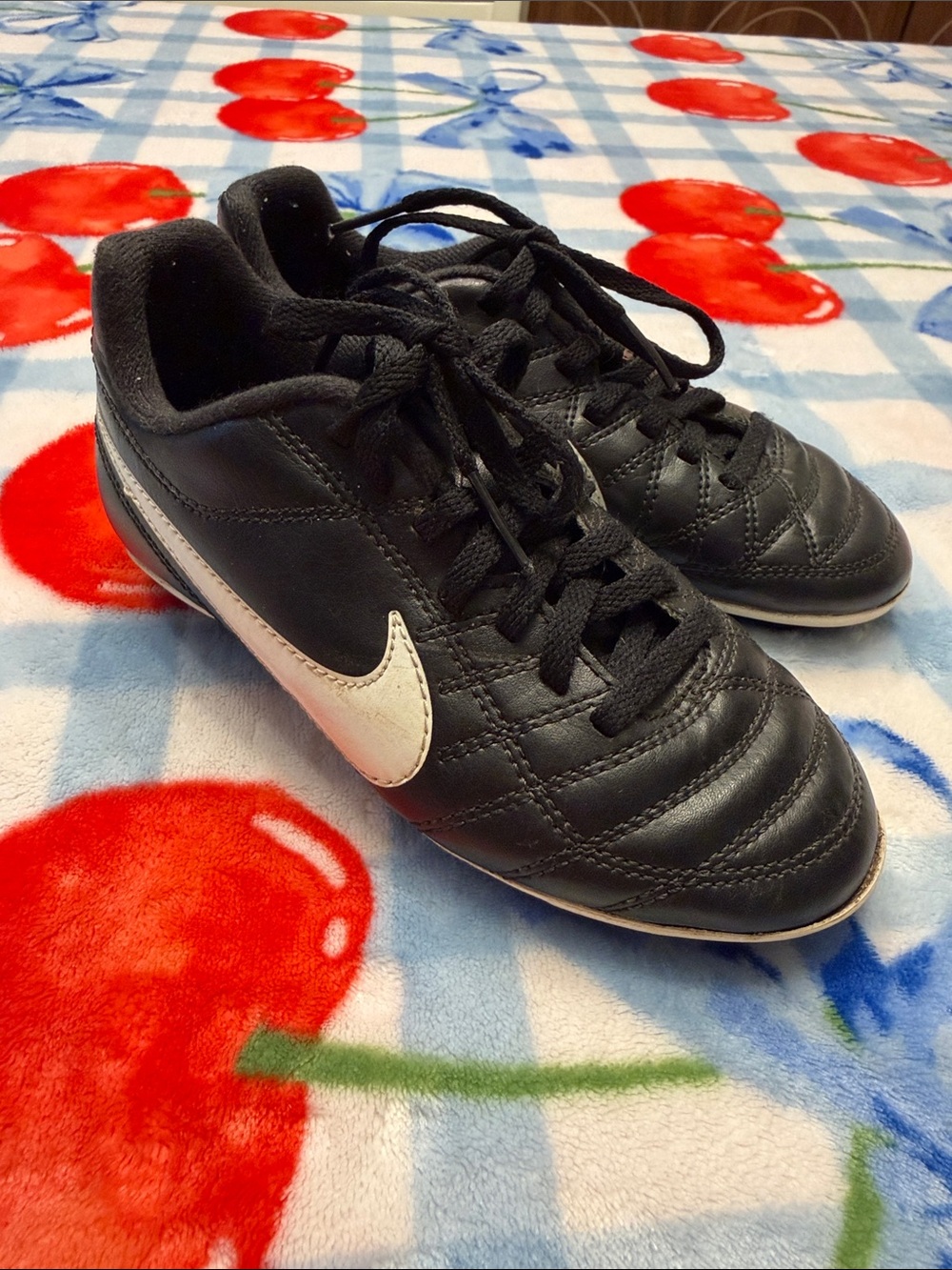 Kids Nike Black Soccer Shoes with White Swoosh